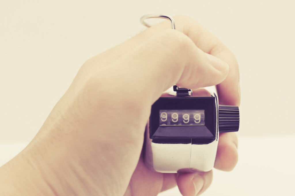 Digital tally counter displaying attendance count at an event